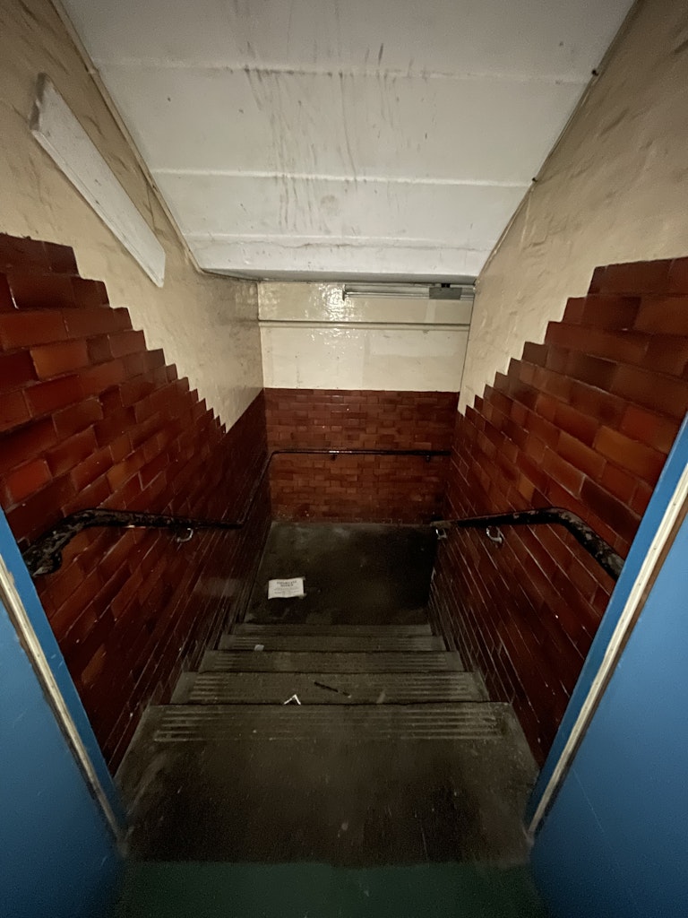 image of stairwell that is dingy and dark to rent for halloween