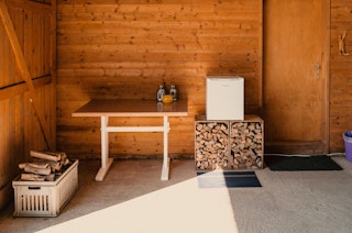 Refrigerator and firewood can be found in the shelter. To the right is the guest room