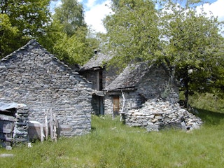 The cottages are built with typical Ticinese stone architecture