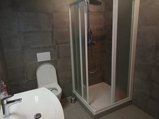 The toilet with shower at your disposal.