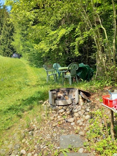 Barbecue area and table under the hazel bush. Above meadow path to the parking lot