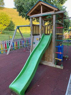 Children's playground with slide and swing